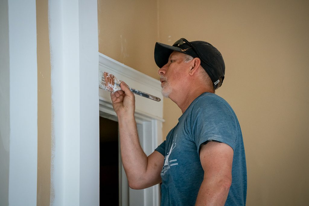 A Serve Louisville volunteer working on the Sanctuary of Sisters building in 2025